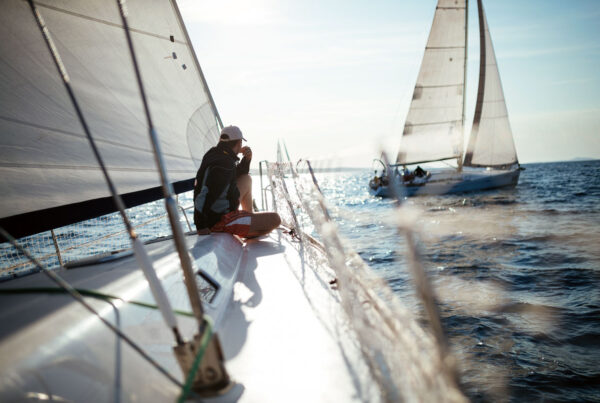 Young, contemplative man on sail boat